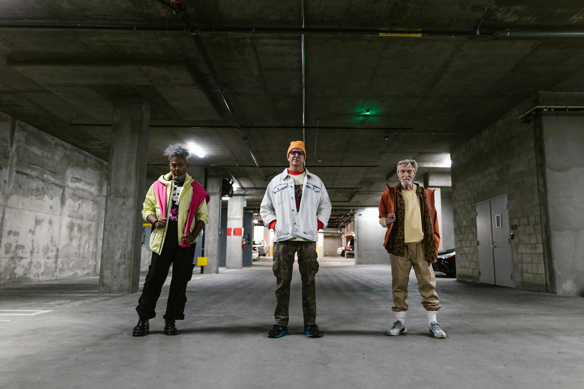 elderly men in stylish outfit standing on a concrete floor
